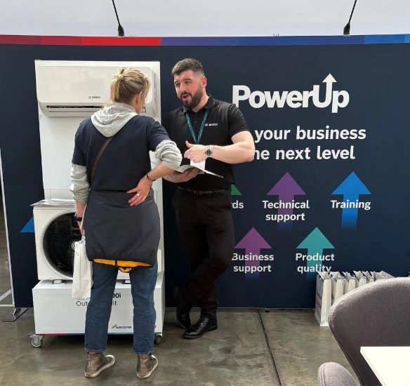 Product stand with Worcester Bosch employee speaking to attendee